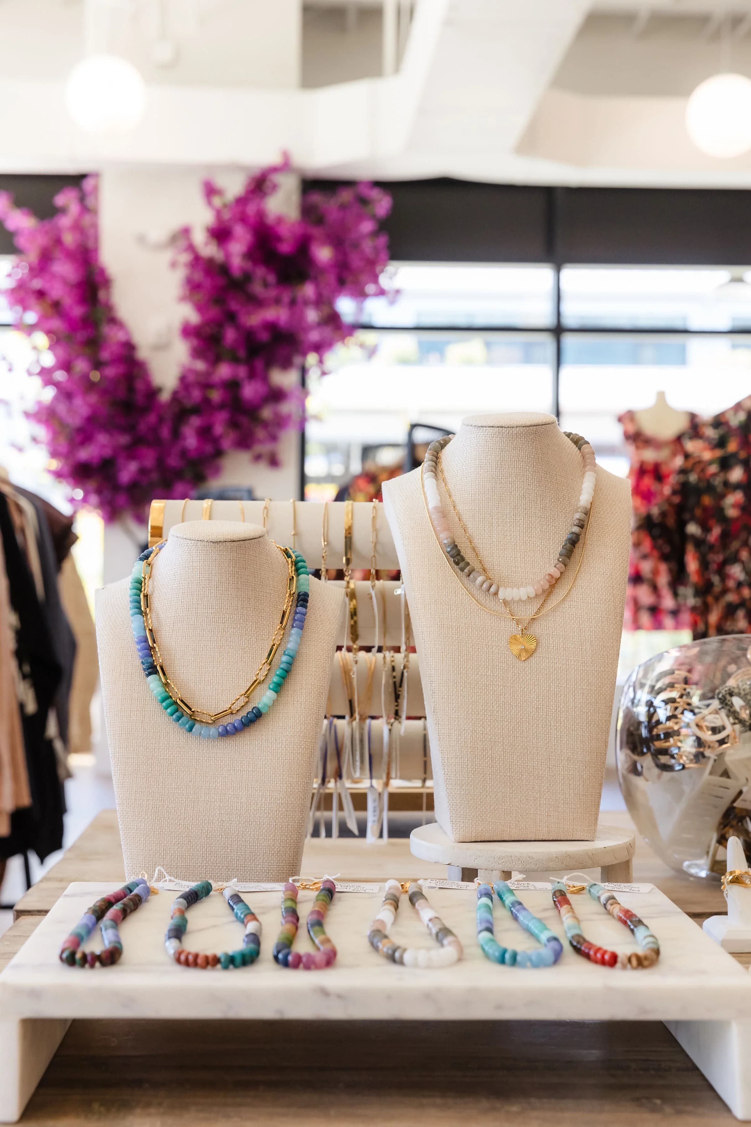 Jewelry displays and flowers inside The Flourish Market