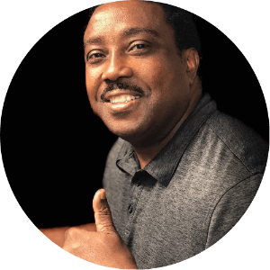 Cycle Studio founder and instructor Travis Jones smiling in a portrait