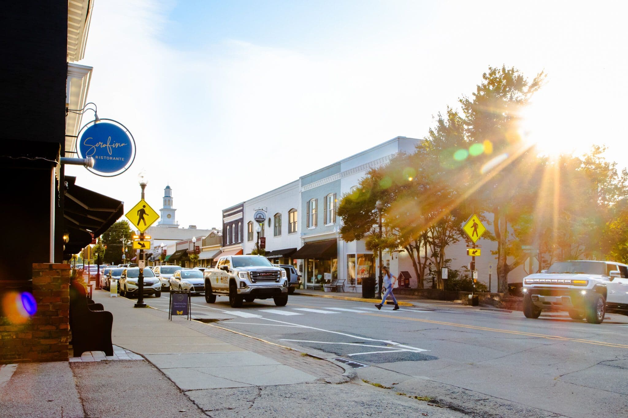 Storefronts, cars and sidewalks along Salem Street in downtown Apex