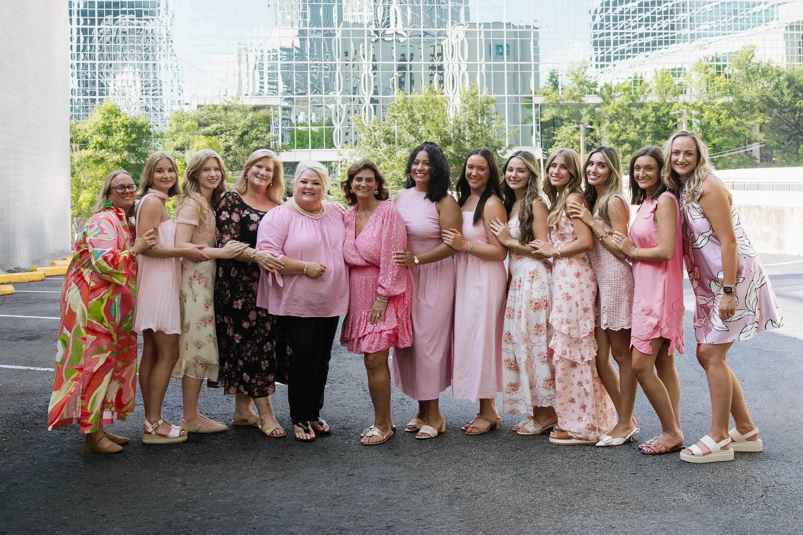 Simply Blush Bridal’s smiling team standing together outside